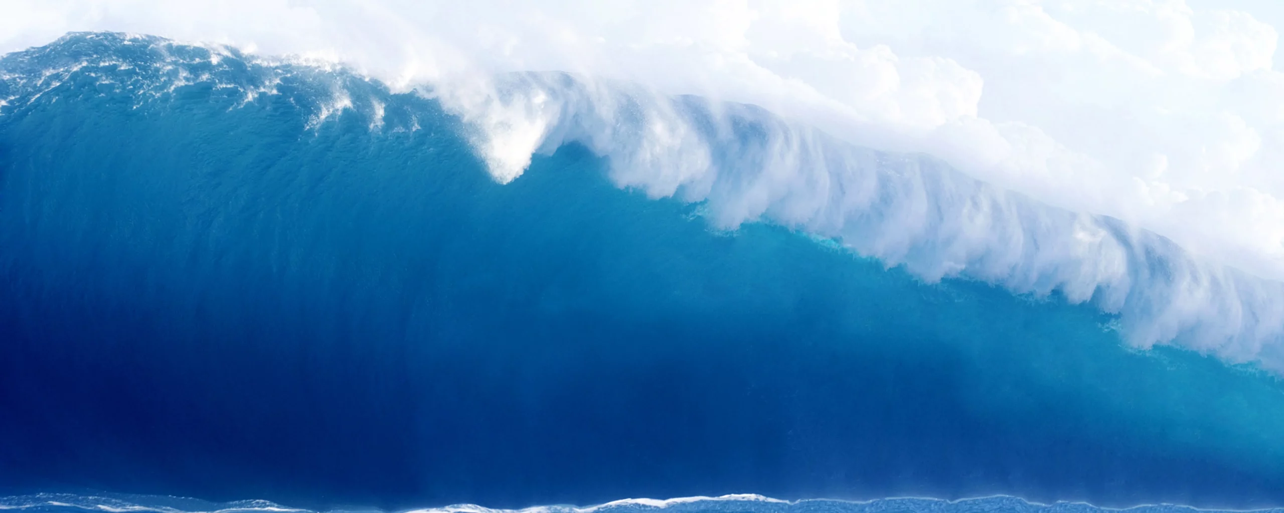 large-blue-surfing-wave-breaks-in-the-ocean-2022-10-10-21-55-48-utc-min
